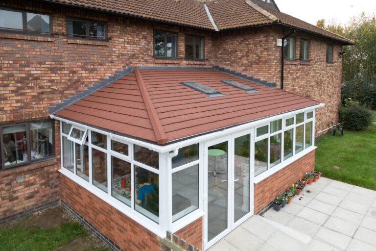 Brown tiled conservatory roof installed by our team in Norwich, Norfolk